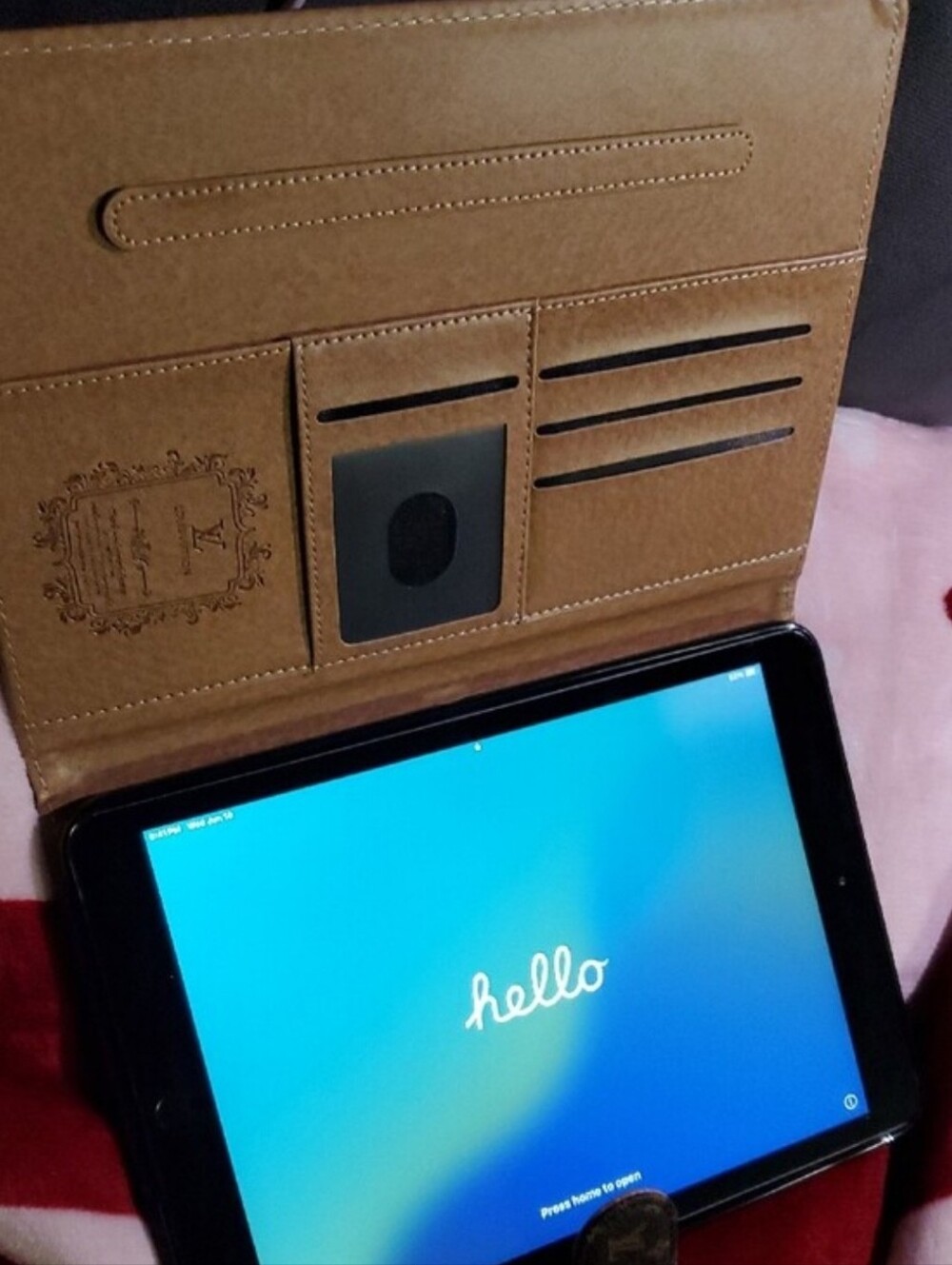 Black Tablet with Blue Screen Apple Ipad With Cases Info In The Pictures